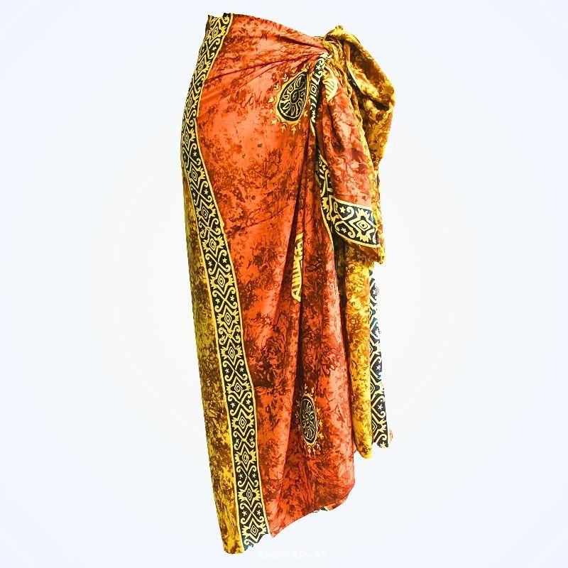 Batikovaný sarong se symboly mincí